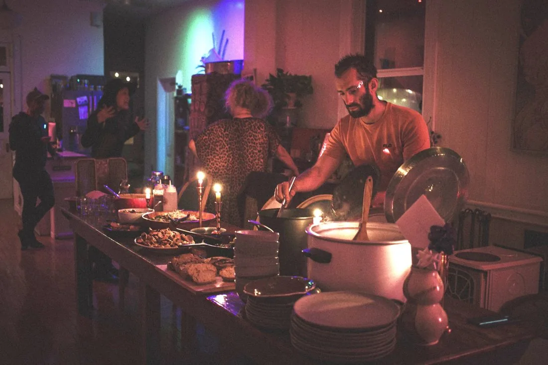 Josh serving at an evening wedding dinner